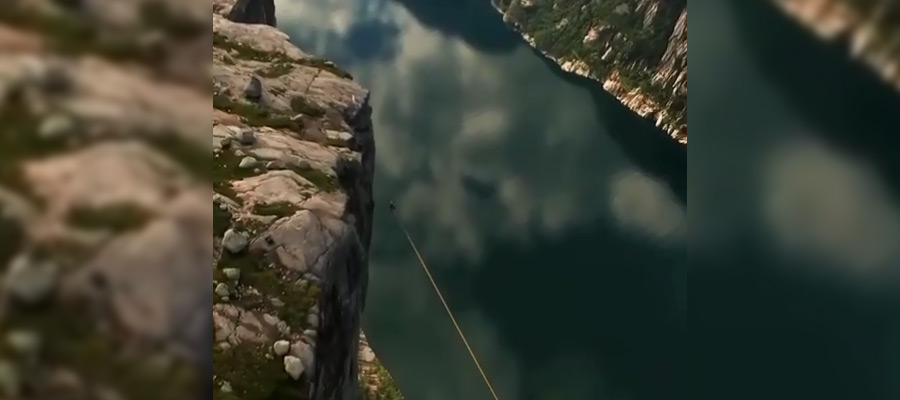 Норвежский экстремал без страховки прошел по канату на высоте километра (видео)
